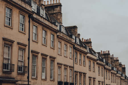 Row of old stone terraced houses on a street in Bath, Somerset, UK.の写真素材