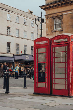 Bath, UK - October 04, 2020: Two red phone booth on a street in Bath, Somerset, UK. Famous red phone boxes can be found in current or former British colonies around the world.のeditorial素材