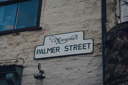 Street name sign on a brick wall of a building on Palmer Street in St Catherines Artisan Quarter in...