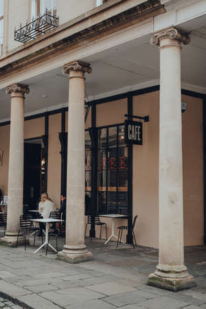 Bath, UK - October 04, 2020: People sitting at the outdoor tables of Fly cafe in Bath, the largest city in the county of Somerset known for and named after its Roman-built baths.のeditorial素材