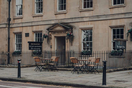 Bath, UK - October 04, 2020: Empty outdoor tables of Apple Tree bed and breakfast in Bath, the largest city in the county of Somerset known for and named after its Roman-built baths.のeditorial素材