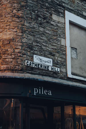 Frome, UK - October 04, 2020: Street name sign on Catherine Hill street in Frome, a market town in...