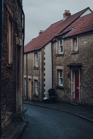 View of a narrow residential street in Frome, Somerset, UK, on a gloomy autumn day.の写真素材