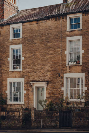 Frome, UK - October 07, 2020: Facade of a traditional stone house in Frome, a market town in the...