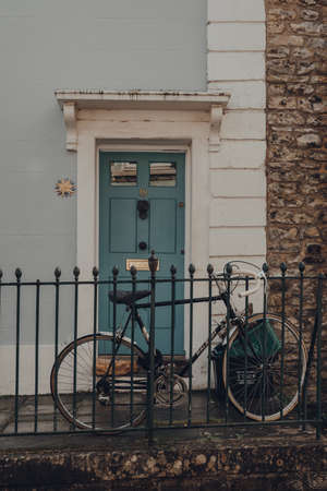 Frome, UK - October 07, 2020: Bike parked outside a traditional stone house in Frome, a market town in the county of Somerset famous for its market and independent shops.のeditorial素材