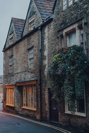 Frome, UK - October 07, 2020: Facade of a traditional stone house in Frome, a market town in the county of Somerset famous for its market and independent shops, at dusk.のeditorial素材