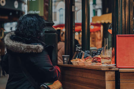 London, UK - November 19, 2020: Sandwiches and hot food on retail display at a take away food stall in Borough Market, one of the largest and oldest food markets in London. Selective focus.のeditorial素材