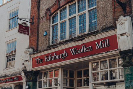 Rye, UK - October 10, 2020: Shop name sign outside closed The Edinburgh Woollen Mill shop in Rye, one of the best-preserved medieval towns in East Sussex, England.のeditorial素材