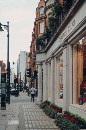 London, UK - December 5, 2020: Exterior of Stefano Ricci clothing store on in Mayfair, an affluent area in the West End of London in the City of Westminster borough, people on the background.のeditorial素材