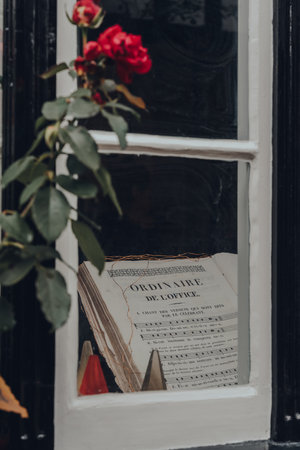 Rye, UK - October 10, 2020: View through the window of music notebook at the window display of The Mermaid Inn, a historic hotel in Rye with cellars dating from 1156 and the building rebuilt in 1420.のeditorial素材
