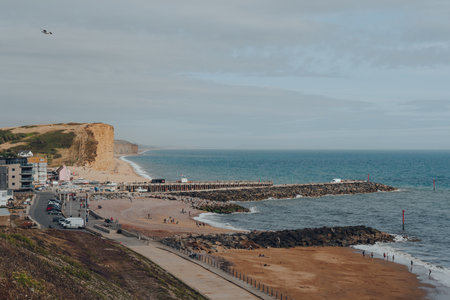 West Bay, UK - July 25, 2020: View from the gill of the coastline in West Bay, a small harbour settlement and resort on the English Channel coast in Dorset.のeditorial素材