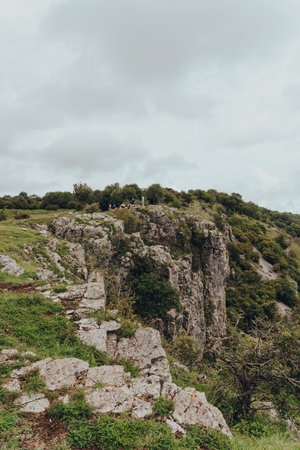 Cheddar Gorge, UK - July 26, 2020: People on top of Cheddar Gorge, a famous limestone gorge in the Mendip Hills, near the village of Cheddar, Somerset, England.のeditorial素材