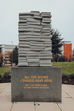Birmingham, UK - January 17, 2021: All The Books I Should Have Read book pile sculpture by Marko Maetamm, a first major piece of art to be displayed at Aston University city centre campus in 15 years.のeditorial素材