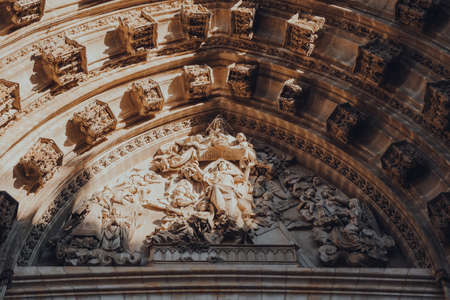 Seville, Spain - January 19, 2020: Close up of architectural details on Seville Cathedral, a Roman Catholic cathedral Seville registered as a UNESCO World Heritage Site.のeditorial素材