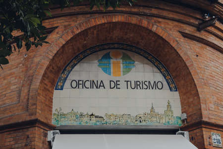 Seville, Spain - January 19, 2020: Sign at the entrance of Tourism Office in Seville, capital of Andalusia region in Southern Spain and a popular tourist destination.のeditorial素材