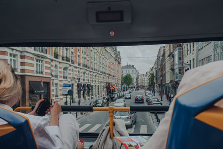 Brussels, Belgium - August 16, 2019: View from top of the tour bus of a street in Brussels, the capital of Belgium and a popular city break destination. Selective focus.のeditorial素材