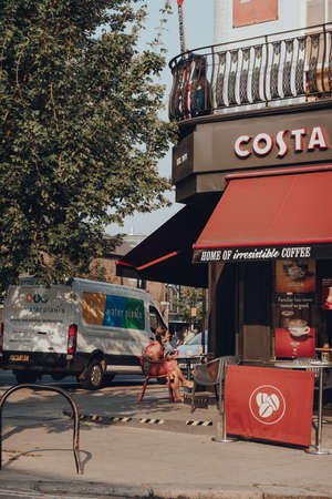 London, UK - August 12, 2020: People sitting at the outdoor tables of Costa coffee shop in Camden Town, London, an area famed for its market and nightlife and popular with tourists.のeditorial素材