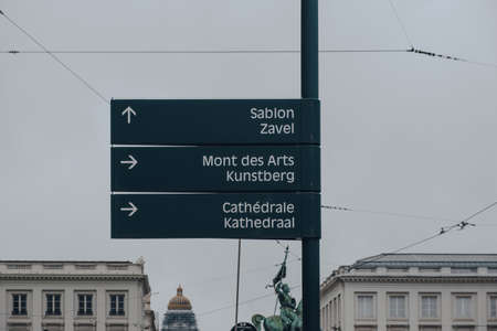 Brussels, Belgium - August 16, 2019: Directional signs to the points of interest on a street in...