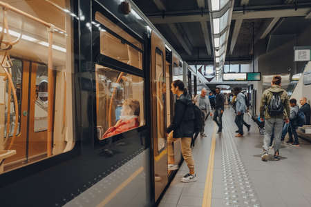 Brussels, Belgium - August 17, 2019: People getting in and out of Brussels Metro carriage. Consisting of four metro and three premetro lines it serves large part of Brussels-Capital Region.のeditorial素材