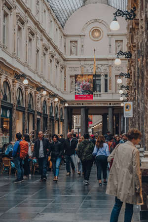 Brussels, Belgium - August 17, 2019: People walking inside Royal Gallery of Saint Hubert, an ensemble of glazed shopping arcades in central Brussels, selective focus.のeditorial素材