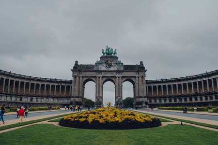 Brussels, Belgium - August 17, 2019: View of Cinquantenaire monumental triple arch in Parc du Cinquantenaire, 19th-century city park in Brussels that is home to art and military museums.のeditorial素材