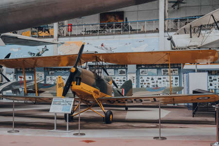Brussels, Belgium - August 17, 2019: de Havilland DH.82 Tiger Moth British biplane on exhibit in The Royal Museum of the Armed Forces and Military History, famous military museum in Brussels.のeditorial素材