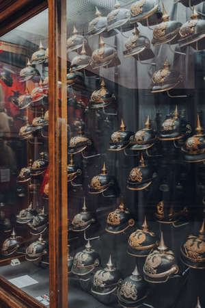 Brussels, Belgium - August 17, 2019: Variety of military helmets on exhibit in The Royal Museum of...