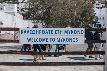 Mykonos Town, Greece - September 23, 2019: Close up of welcome to Mykonos sign at the arrivals in the port of Hora (also known as Mykonos Town), the islands well-preserved port and capital.のeditorial素材