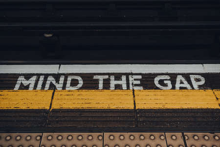 London, UK - September 03, 2021: Mind the gap sign on of Moorgate underground station platform of London Underground, the oldest underground railway in the world.のeditorial素材