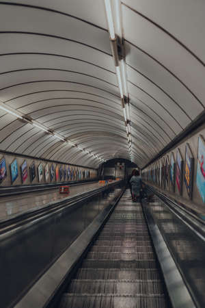 London, UK - September 03, 2021: Downward escalator at Moorgate London Underground station, the oldest underground railway in the world, selective focus.のeditorial素材
