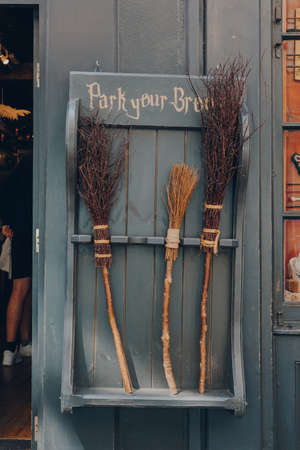 York, UK - June 22, 2021: Park your broom display outside Facade of The Shop That Must Not Be Named, a Harry Potter themed shop on Shambles, an old street in York dating back to the fourteenth centuryのeditorial素材