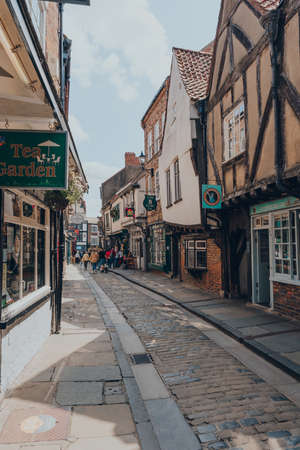 York, UK - June 22, 2021: View The Shambles, an old street in York, England, with overhanging timber-framed buildings, some dating back as far as the fourteenth century.のeditorial素材