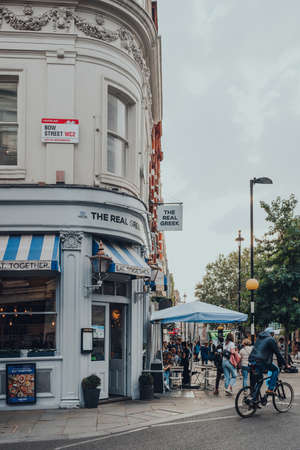 London, UK - October 09, 2021: The Real Greek restaurant on a street in Covent Garden, a famous tourist area in London with lots of shops and eateries.のeditorial素材