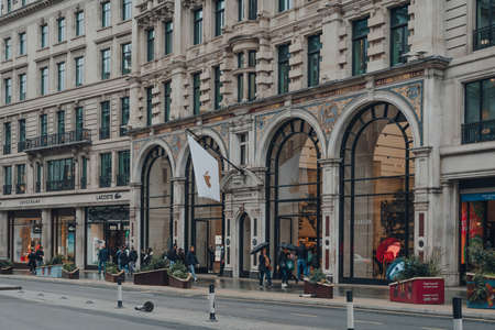 London, UK - October 02, 2021: People walking in front of Apple Store on Regent Street, London. Regent Street store was the first Apple in Europe.のeditorial素材