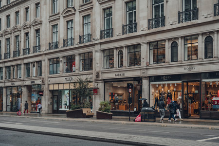 London, UK - October 02, 2021: Few people walking past the open shops on quiet Regent Street, a major and typically busy shopping street in the West End of London.のeditorial素材