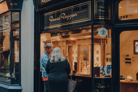 London, UK - October 02, 2021: People looking at retail display of David Duggan shop in Burlington...