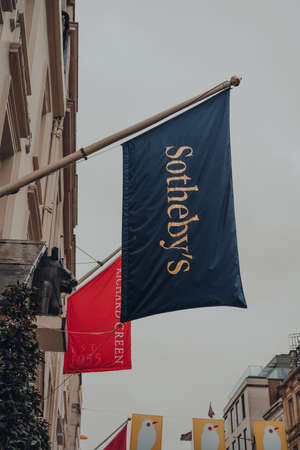 London, UK - October 02, 2021: Low angle view of the flag outside Sotheby's, one of the world's...