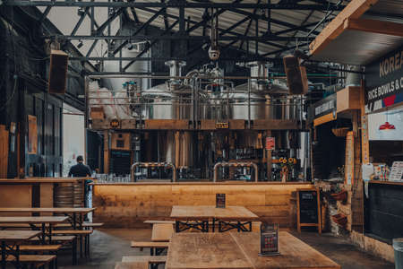 London, UK - October 17, 2021: German Kraft microbrewery and bar in Mercato Metropolitano, the first sustainable community market in London focused on revitalising the area and protecting environment.のeditorial素材
