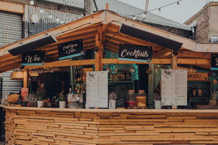 London, UK - October 17, 2021: The French Corner outdoor bar in Mercato Metropolitano, the first sustainable community market in London focused on revitalising the area and protecting environment.のeditorial素材