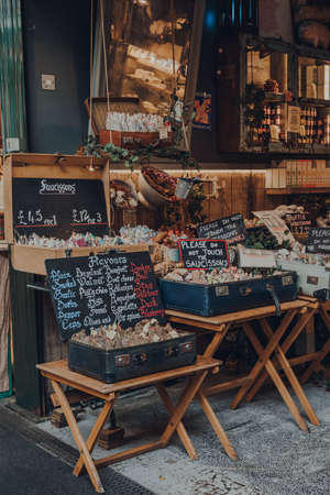 London, UK - October 17, 2021: Variety of saucissons on sale at a charcuterie stand inside Borough Market, one of the largest and oldest food markets in London.のeditorial素材