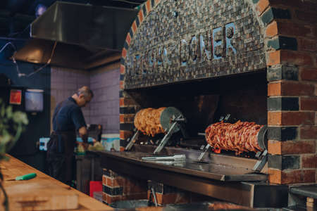 London, UK - October 17, 2021: Meat cooking at Duman Doner stall in Mercato Metropolitano, the first sustainable community market in London focused on revitalising the area and protecting environment.のeditorial素材