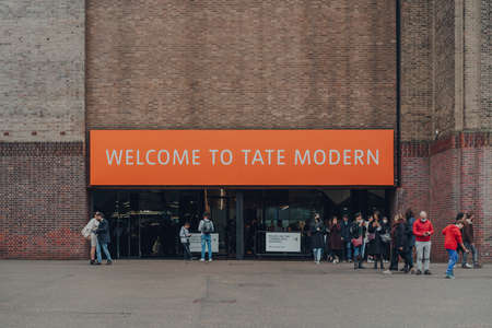 London, UK - October 17, 2021: Welcome sign at the entrance of Tate Modern, a museum in London that holds the nation's collection of modern art from 1900 to the present day.のeditorial素材