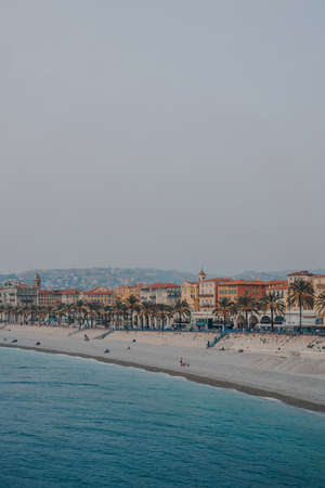 Nice, France - March 11, 2022: View of the beach and the city of Nice, a famous tourist destination on the French Riviera, from a viewpoint on Quai Rauba Capeu.のeditorial素材