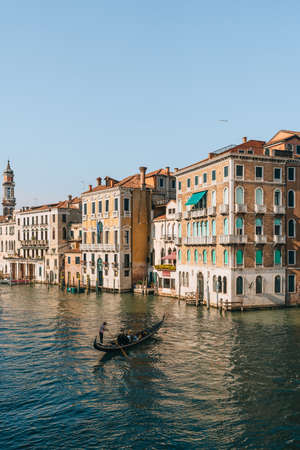 Venice, Italy - May 21, 2022: Gondola navigating through Grand Canal and the buildings from Rialto bridge in Venice, capital of Veneto region and a famous travel destination.のeditorial素材