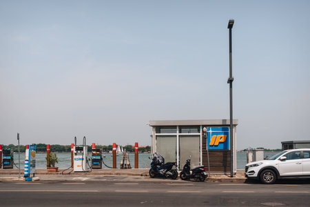 Venice, Italy - May 22, 2022: Vehicle and boat petrol station operated by IP on Lido Island, a barrier island in Venetian Lagoon famous for its Film Festival.のeditorial素材