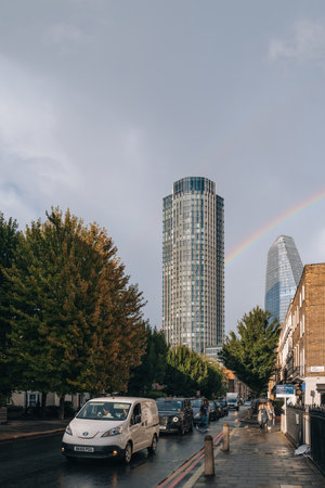 London, UK - September 8, 2022: View of a rainbow behind Southbank Tower, a mixed use high-rise building in Stamford Street, Southwark, London.のeditorial素材