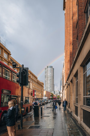 London, UK - September 8, 2022: View of a rainbow behind Southbank Tower, a mixed use high-rise building in Stamford Street, Southwark, from the street.のeditorial素材