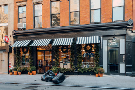 New York, USA - November 21, 2022: Festive decorated Sezane shop on Elizabeth Street in Nolita, a charming and upscale area of Manhattan famous for its shops and restaurants.のeditorial素材