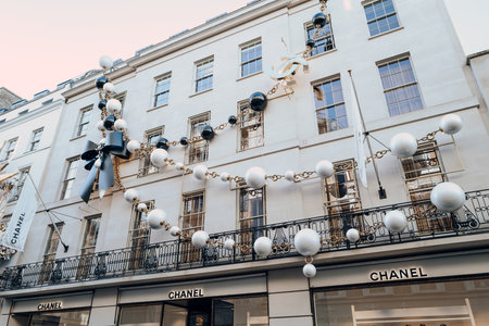 London, UK - December 26, 2022: Giant necklace Christmas decoration on the exterior of Chanel store on New Bond Street, one of the most famous streets for luxury shopping in London.のeditorial素材