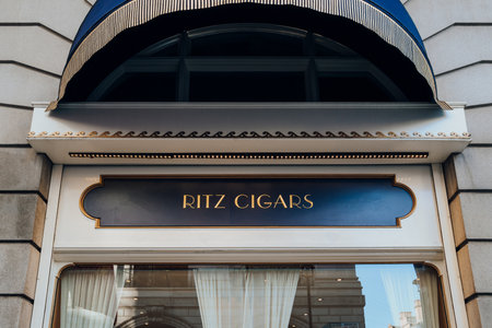 London, UK - December 26, 2022: Sign outside Ritz Cigars, a luxurious indoor cigar lounge in London with a prestigious selection sold in its premium cigar shop.のeditorial素材